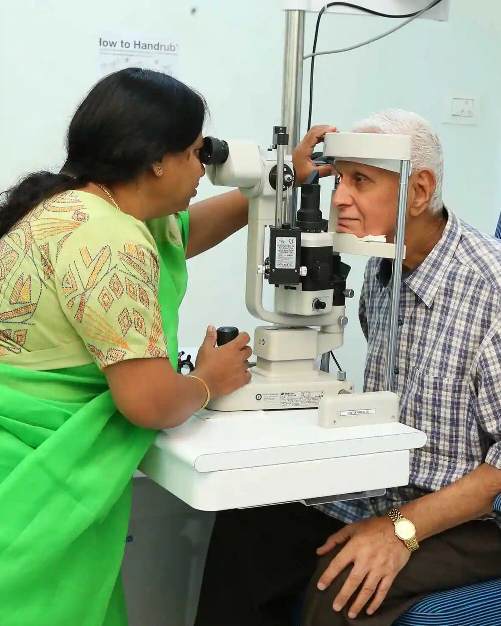 High Sight clinician examining a patient at the slit lamp